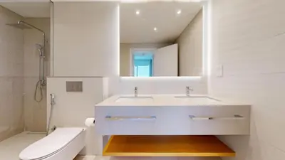 a bathroom with a sink and a toilet and a mirror at Vacationer l Chic 2 Bedroom l Sea Views l Private Beach Access in Dubai