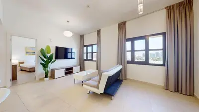 a hospital room with a bed and a tv at Vacationer l Cozy 1 Bed l Jumeirah Golf Estate l Free Pool, Gym in Dubai