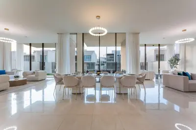 a dining room with a table and chairs at Vacationer l Breathtaking 5 Bed Villa l Luxurious & Spacious in Dubai