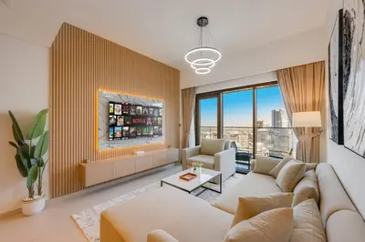 a living room with a couch and a fireplace at Luxury 2 bed, 5 mins walk to Dubai Mall and Burj Khalifa in Dubai