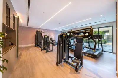 a gym with treadmills and cardio equipment in a room at Luxury 2 bed, 5 mins walk to Dubai Mall and Burj Khalifa in Dubai