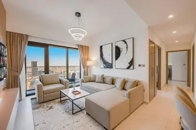 a living room with a couch and a table at Luxury 2 bed, 5 mins walk to Dubai Mall and Burj Khalifa in Dubai