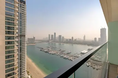 a view of a harbor with boats in the water at Waves - Beachfront Bliss - Marina Vista 1BR Escape in Dubai