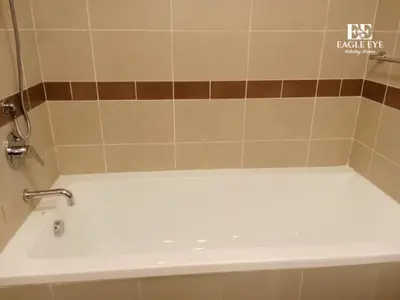 a white bath tub with a faucet in a bathroom at 2BR Downtown Dubai - Near Burj Khalifa - Private Podium Seating - Sleeps 4 in Dubai