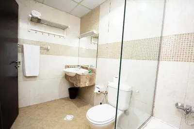 a bathroom with a toilet and a sink at Newly furnished Studio at city tower building in barsha 1 in Dubai