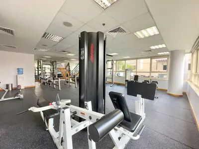 a gym with cardio equipment in a building at Charming 2BR in Dubai Marina with Lake View in Dubai