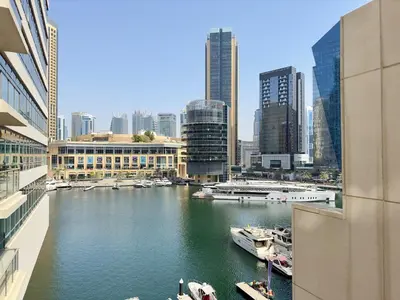 a view of a river with boats in a city at Charming 2BR in Dubai Marina with Lake View in Dubai