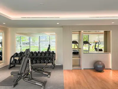 a room with a gym with a bench and weights at Silkhaus Luxury New Tower in City Walk in Dubai