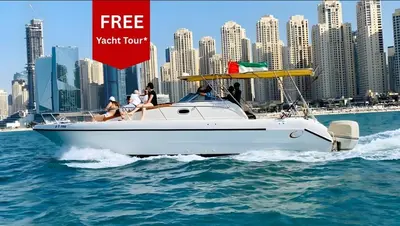 a group of people riding on a boat in the water at Marina Sky Luxe Penthouse in Dubai