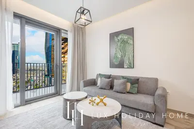 a living room with a couch and a table at LUX The Business Bay Executive Suite in Dubai