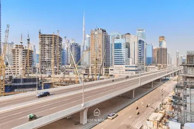 an overhead view of a highway in a large city at Brand New 1B with Burj Khalifa View in Business Bay in Dubai