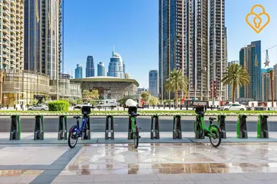 three bikes parked next to a fence in a city at Seaview 3 BR Burj Vista Connected to Dubai Mall in Dubai