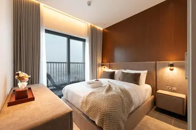 a hotel room with a bed and a large window at Luxury 1BR Retreat near DIFC & Downtown Dubai in Dubai