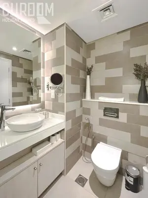 a bathroom with a white toilet and a sink at Great Cozy Studio on Palm Jumeirah in Dubai