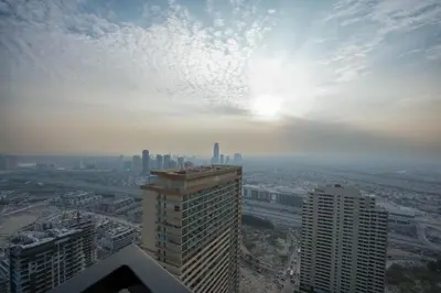 a view of a city from the top of a building at Modern 1BR Apartment with Private Pool in JVC in Dubai