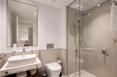 a bathroom with a sink and a toilet and a shower at Designer 1BR with Skyline View in MJL - Near Iconic Burj Al in Dubai