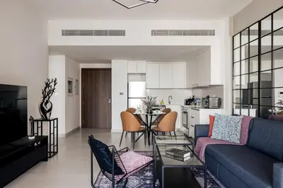 a living room with a couch and a table at Designer 1BR with Skyline View in MJL - Near Iconic Burj Al in Dubai