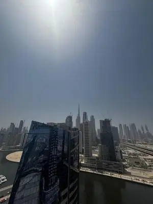 a view of a city from the top of a skyscraper at High-Floor 1BR Escape - The Bay Rooftop Pool in Dubai