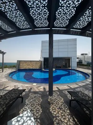a swimming pool in the middle of a building at High-Floor 1BR Escape - The Bay Rooftop Pool in Dubai
