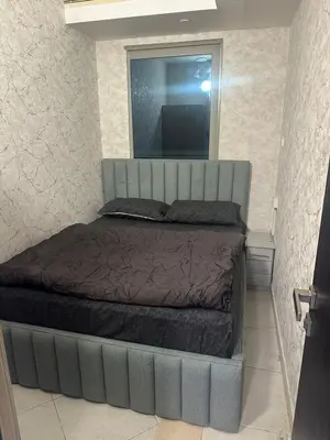 a large bed in a bedroom with a mirror at Marina Sea View Room Dubai in Dubai
