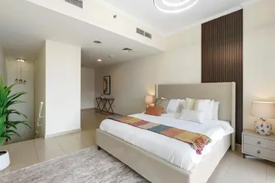 a bedroom with a large bed in a room at HAVN - High Floor 1 bedroom in JLT in Dubai