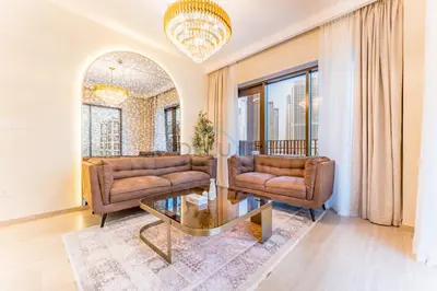 a living room with two couches and a table at Elegant 1BR, Easy Access to Creek Harbour Night Vision - Summer at Creek Beach Building 3 by Deluxe Holiday Homes in Dubai