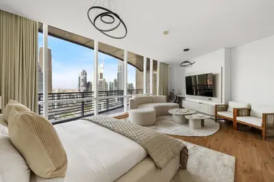 a bedroom with a bed and a large window at Luxury High-Floor Suite Museum of the Future View in Dubai