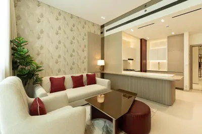 a living room with a couch and a table at Refined Apartment with Private Balcony Pool in Dubai