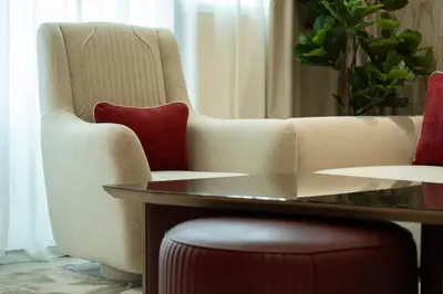 a living room with a couch and a table at Refined Apartment with Private Balcony Pool in Dubai