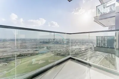 an office building with a view of a city at High-Floor 2BR with Vibrant Street Views and Effortless Drive Access to Downtown Hotspots, Nobles Tower, Business Bay by Deluxe Holiday Homes in Dubai