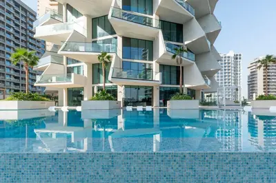 a building with a pool in front of it at Modern Apartment with Private Balcony Pool in Dubai