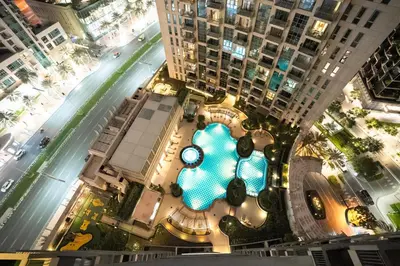 an overhead view of a shopping mall with tall buildings at Spacious 1BR & Study Burj Khalifa View, Downtown in Dubai