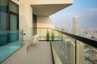 a balcony with a view of a city at Sophisticated Apartment with Private Pool in Dubai