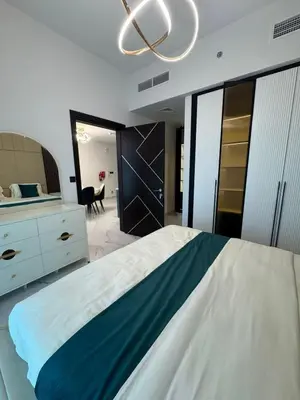a bedroom with a large bed and a mirror at Opalz 1 bhk luxury apt for family and couple with swimming pool in Dubai