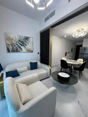 a living room with a couch and a table at Opalz 1 bhk luxury apt for family and couple with swimming pool in Dubai