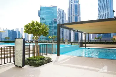 a swimming pool in a city with tall buildings at Premium 2BR Residence in Downtown Dubai in Dubai