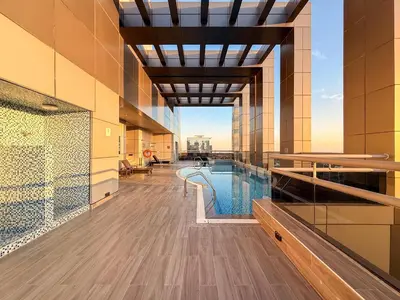 a swimming pool in a building with a view at GuestReady - 1BR | JLT Apt near Metro Station in Dubai