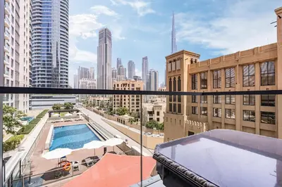 a view of the city from the balcony of a building at Chic Central Downtown Home with Burj View in Dubai