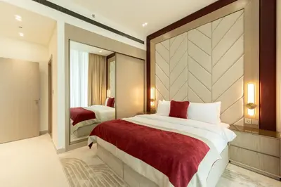 a bedroom with a large bed and a mirror at Exclusive Luxury Apartment with Private Pool in Dubai