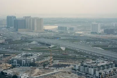 an aerial view of a city with a highway at Exclusive Luxury Apartment with Private Pool in Dubai