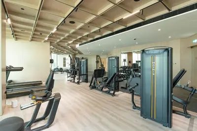 a gym with treadmills and cardio equipment in a building at Exclusive Luxury Apartment with Private Pool in Dubai