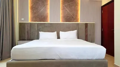 a bedroom with a large bed with white sheets at Elan Rimal Bahar Suites, 1min walk to the Sea! Prime location JBR Beach Front in Dubai