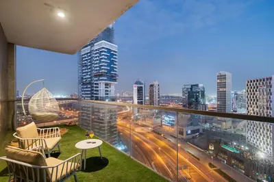 a balcony with a view of a city skyline at Luxury 3BR in Mada Residences - Walk to Dubai Mall in Dubai