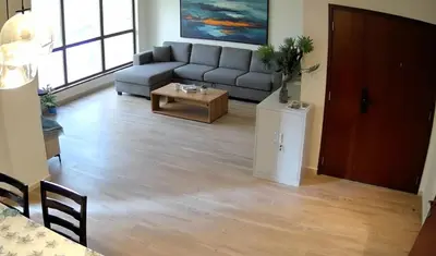 a living room with a couch and a table at Festive Winter Stay in JBR - Beach, Marina, Metro in Dubai