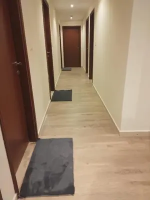 a hallway of an office building with a black mat on the floor at Festive Winter Stay in JBR - Beach, Marina, Metro in Dubai
