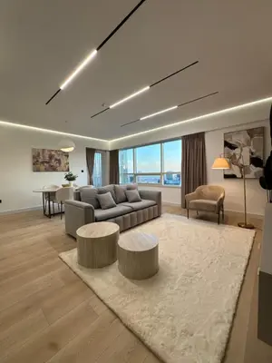 a living room with a couch and a table at Sky-High Luxury 1BR Best Views of Dubai Marina Emaar 39th Floor in Dubai