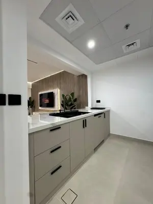 a kitchen with white cabinets and a sink at Sky-High Luxury 1BR Best Views of Dubai Marina Emaar 39th Floor in Dubai