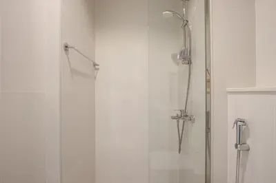 a shower with a glass door in a bathroom at 3BR Townhouse Rooftop Terrace Just Cavalli in Dubai