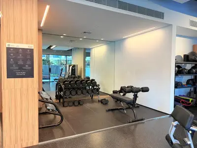 a gym with a lot of equipment in a room at Cozy & Stylish 1BR in Wilton Terraces in Dubai