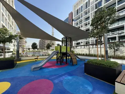 a playground with a slide in a building at Fresh & Modern Studio in Meydan - Azizi Riviera 67 in Dubai